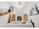 Open living room featuring a fireplace, staircase, skylight, and contemporary decor at 5741 S Pearl St, Las Vegas, NV 89120