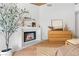 Elegant main bedroom with fireplace, hardwood floors, and sophisticated decor for a serene retreat at 5741 S Pearl St, Las Vegas, NV 89120