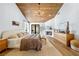 Inviting main bedroom with fireplace, hardwood floors, wooden ceiling, and ample natural light at 5741 S Pearl St, Las Vegas, NV 89120