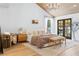 Serene main bedroom boasting hardwood floors, wooden ceiling, fireplace, and access to a private balcony at 5741 S Pearl St, Las Vegas, NV 89120