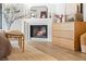 Charming main bedroom featuring a fireplace, hardwood floors, and soft, natural light at 5741 S Pearl St, Las Vegas, NV 89120