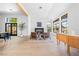 Bright sitting room features a fireplace and large windows with views of the outside at 5741 S Pearl St, Las Vegas, NV 89120
