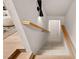 Stairwell with carpeted steps, wooden handrail, and contemporary sconce lighting at 5741 S Pearl St, Las Vegas, NV 89120