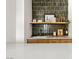 Close up on modern wet bar with sink, light wood cabinetry and stylish tiled backsplash at 5741 S Pearl St, Las Vegas, NV 89120