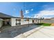 This backyard has a large concrete area, brick chimney, and small patch of artificial turf at 5800 Balzar Ave, Las Vegas, NV 89108