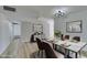 Elegant dining room with a modern table, stylish chairs, and contemporary decor at 5800 Balzar Ave, Las Vegas, NV 89108