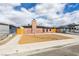 Charming single-story brick home with a unique brick chimney and stylish desert landscaping in the front yard at 5800 Balzar Ave, Las Vegas, NV 89108