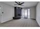 Spacious living room with a brick fireplace and access to the backyard at 5800 Balzar Ave, Las Vegas, NV 89108