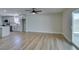 Living space with modern cabinets, wood-style flooring and sliding doors at 5800 Balzar Ave, Las Vegas, NV 89108