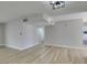 Bright living space showcasing wood floors, neutral walls, and recessed lighting at 5800 Balzar Ave, Las Vegas, NV 89108