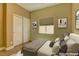 Neutral bedroom featuring a large window, closet with mirrored doors and contemporary decor at 6236 Tierra Cove St, North Las Vegas, NV 89081