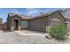 Charming single story home with a desert landscape and an attached garage at 6236 Tierra Cove St, North Las Vegas, NV 89081