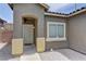 Inviting front entrance with walkway, covered porch and desert landscaping at 6236 Tierra Cove St, North Las Vegas, NV 89081