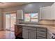 Clean kitchen featuring granite counters, stainless appliances and access to the backyard at 6236 Tierra Cove St, North Las Vegas, NV 89081