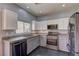 Modern kitchen with granite counters, stainless steel appliances, and ample cabinet space at 6236 Tierra Cove St, North Las Vegas, NV 89081
