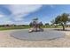 Community playground features a slide and climbing structure on a safety surface at 6236 Tierra Cove St, North Las Vegas, NV 89081
