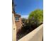 Upstairs backyard balcony with tree view at 6554 Macdoogle St, Las Vegas, NV 89166
