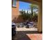Outdoor seating area featuring a patio with stylish chairs and lush landscaping at 6554 Macdoogle St, Las Vegas, NV 89166