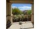 Inviting balcony with serene surroundings and an inviting view to the trees and neighboring houses at 6554 Macdoogle St, Las Vegas, NV 89166