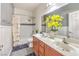 Charming bathroom featuring double sinks, subway tile shower, and stylish decor at 6554 Macdoogle St, Las Vegas, NV 89166