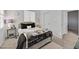 Comfortable bedroom with a plush bed, neutral decor, and ample natural light for a serene retreat at 6554 Macdoogle St, Las Vegas, NV 89166