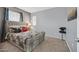 Comfortable bedroom featuring a Queen bed, neutral carpet, and plenty of natural light at 6554 Macdoogle St, Las Vegas, NV 89166