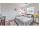 Inviting bedroom with soft carpet, bright windows, and relaxing ambiance at 6554 Macdoogle St, Las Vegas, NV 89166