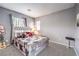 Stylish bedroom with comfortable bed, plush pillows, and neutral decor at 6554 Macdoogle St, Las Vegas, NV 89166