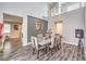 Elegant dining room with vaulted ceilings, stylish seating for six, and modern decor at 6554 Macdoogle St, Las Vegas, NV 89166