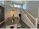 Spacious dining area with a view of the staircase and modern decor, perfect for Gathering gatherings at 6554 Macdoogle St, Las Vegas, NV 89166
