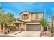 Charming two-story home with well-manicured landscaping and a welcoming entrance at 6554 Macdoogle St, Las Vegas, NV 89166