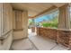 Charming covered front porch featuring stone accents and offering a welcoming entrance to the home at 6554 Macdoogle St, Las Vegas, NV 89166