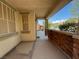 Covered front porch with stone detailing and a view of the neighborhood street at 6554 Macdoogle St, Las Vegas, NV 89166