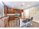 Stylish kitchen with stainless steel appliances, granite countertops, and a breakfast bar with seating at 6554 Macdoogle St, Las Vegas, NV 89166