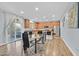 Open-concept kitchen with modern appliances, ample counter space, and a view of the dining area at 6554 Macdoogle St, Las Vegas, NV 89166