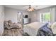 Comfortable main bedroom with gray paint, wood floors, and private balcony access at 6554 Macdoogle St, Las Vegas, NV 89166