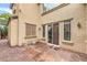 Rear of house with large sliding door to patio at 6554 Macdoogle St, Las Vegas, NV 89166