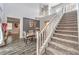Inviting staircase leading to the upper level with a dining area and stylish decor at 6554 Macdoogle St, Las Vegas, NV 89166
