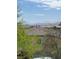 Scenic view of neighboring rooftops and distant mountains provides a tranquil backdrop at 6554 Macdoogle St, Las Vegas, NV 89166