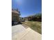 The backyard features a small shed and a lush grassy area, perfect for additional storage and outdoor activities at 6596 Secluded Ave, Las Vegas, NV 89110