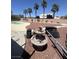 The backyard has gravel landscaping with tall palm trees and a water feature at 6596 Secluded Ave, Las Vegas, NV 89110
