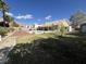Expansive backyard with a sparkling pool, mature landscaping, and covered patio, perfect for outdoor entertaining at 6596 Secluded Ave, Las Vegas, NV 89110