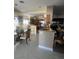 Dining room and kitchen area featuring granite countertops and stainless steel appliances at 6596 Secluded Ave, Las Vegas, NV 89110