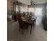 Dining room featuring a spacious dining table and glass cabinet at 6596 Secluded Ave, Las Vegas, NV 89110