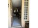 Inviting entryway with tiled floor, decorative lighting, and a view into the living area at 6596 Secluded Ave, Las Vegas, NV 89110