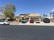 Charming single-story home featuring a tile roof, solar panels, desert landscaping, and a multi-car driveway at 6596 Secluded Ave, Las Vegas, NV 89110