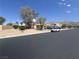 Inviting single-story home with desert landscaping and views of mountains in the distance at 6596 Secluded Ave, Las Vegas, NV 89110