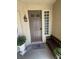 Welcoming front entry features a bench, decorative accents, and a charming welcome mat at 6596 Secluded Ave, Las Vegas, NV 89110