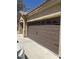 Close-up of a well-maintained three-car garage door with decorative hardware and a clean, modern appearance at 6596 Secluded Ave, Las Vegas, NV 89110