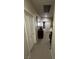 Hallway with a carpeted floor, wooden furniture, and doorway, perfect for adding a touch of elegance at 6596 Secluded Ave, Las Vegas, NV 89110